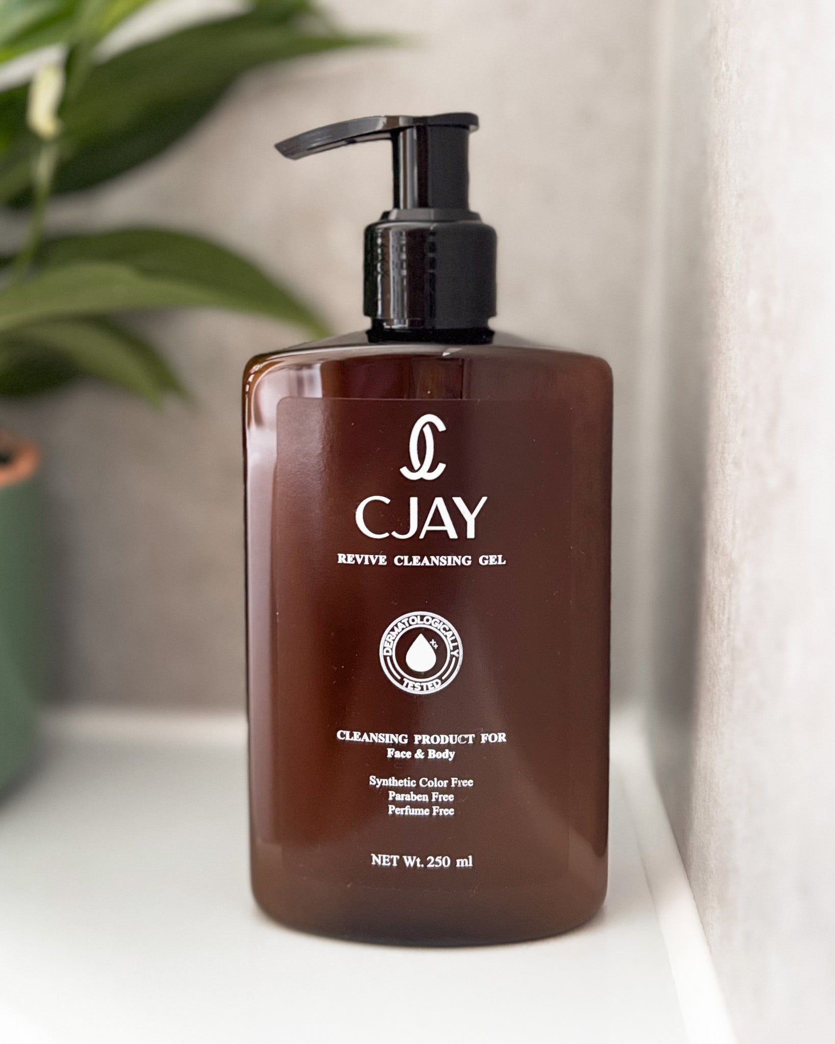 CJAY Revive Cleansing Gel bottle in a bathroom setting 